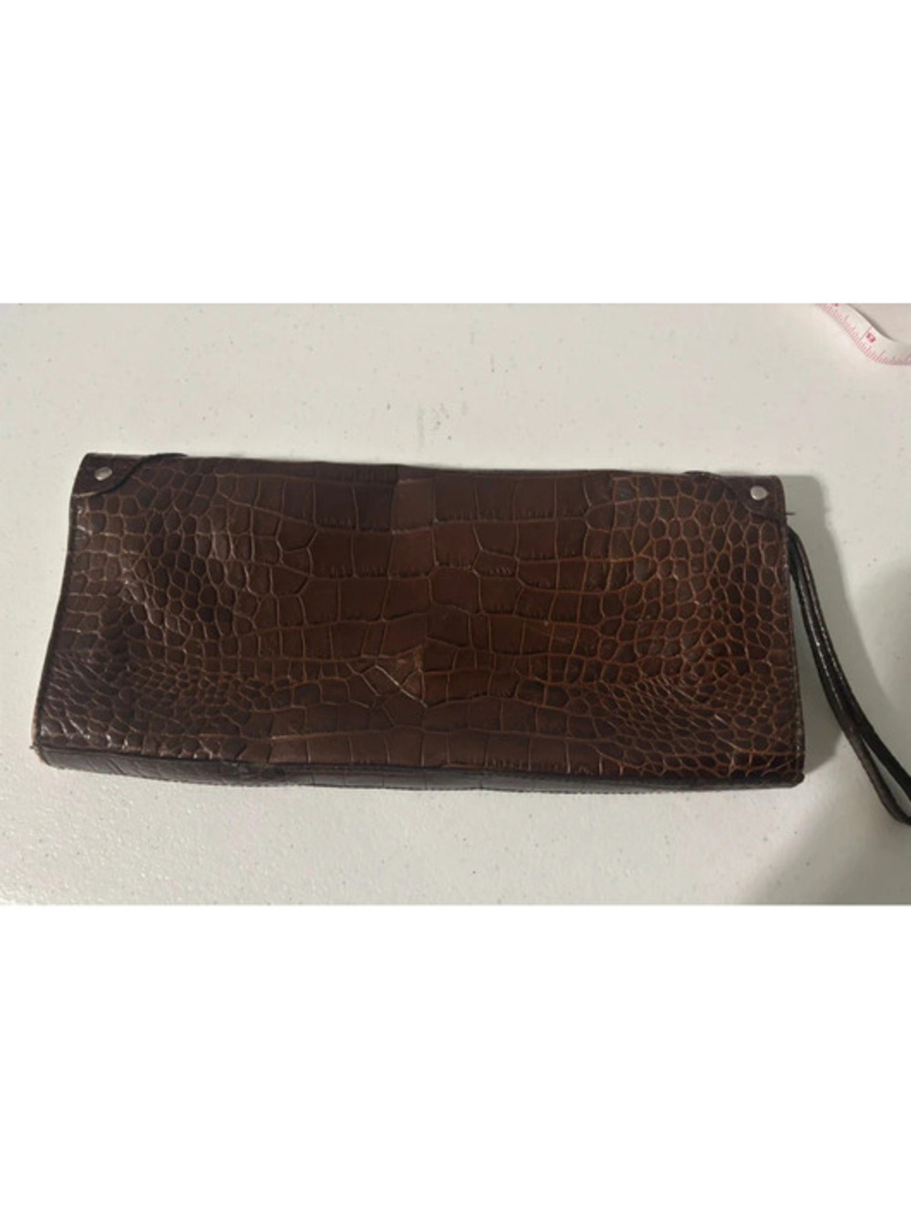 Brown croc-embossed leather clutch and wristlet by Claudia Firenze